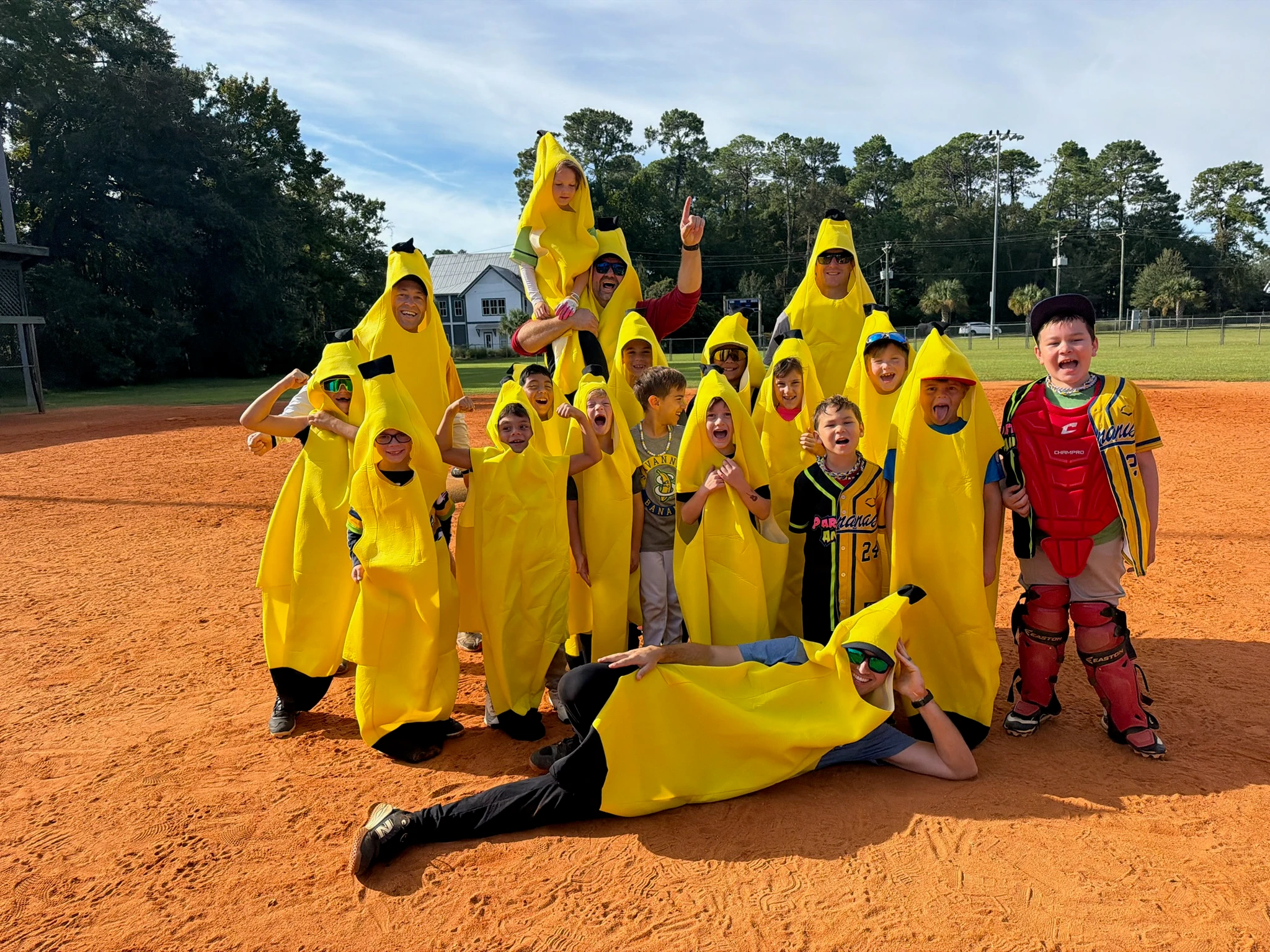 team and coaches in banana costumes