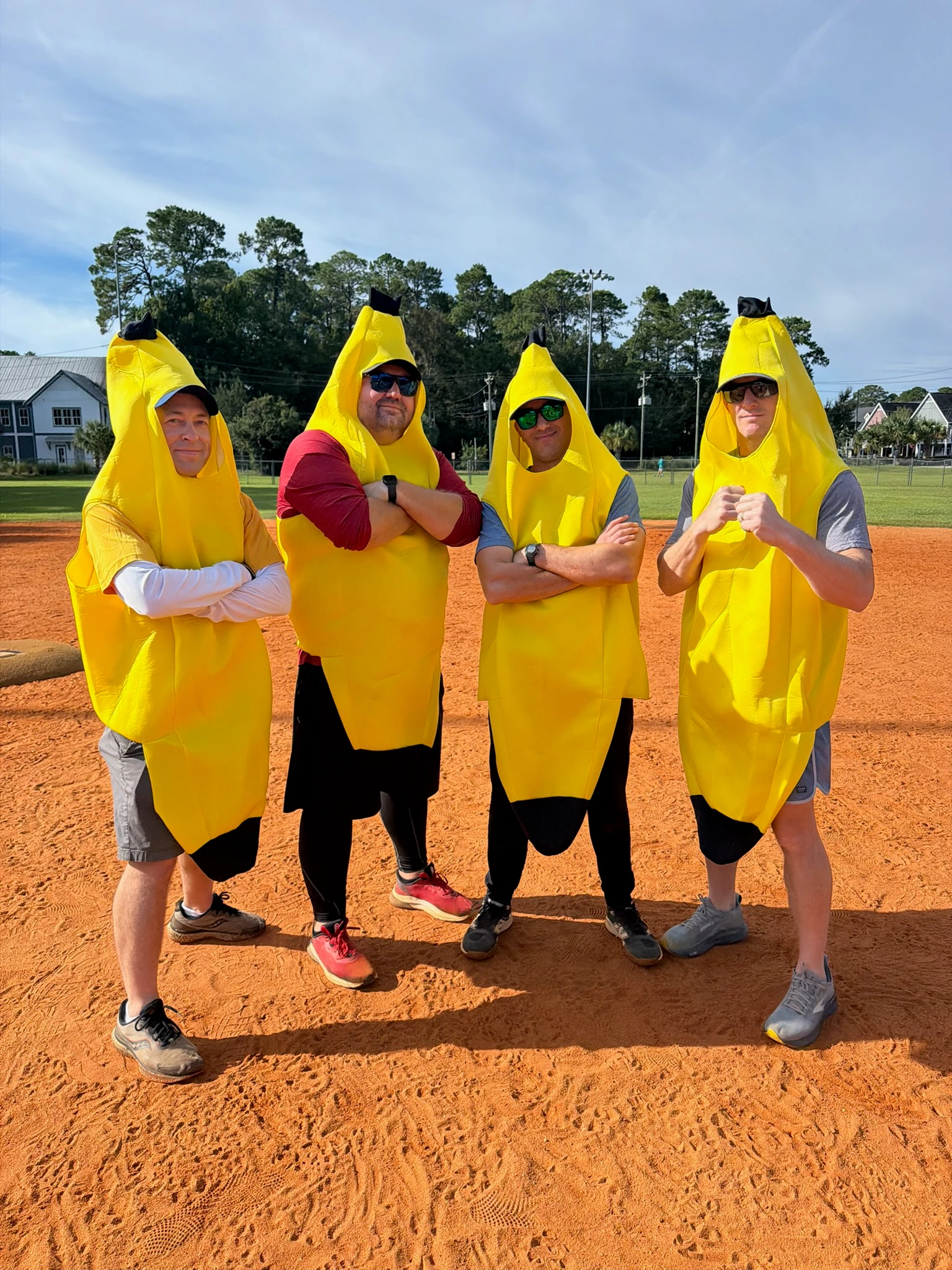 the coaching staff in banana costumes